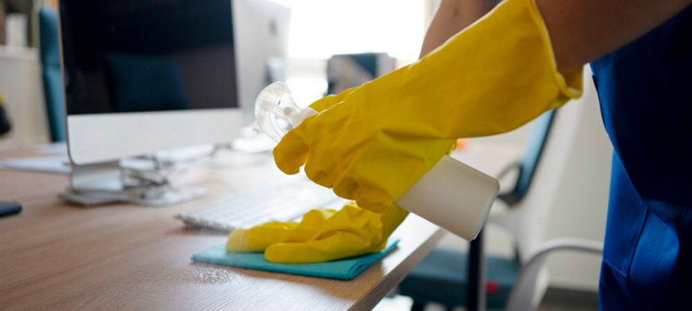 A cleaner cleaning a office cabin