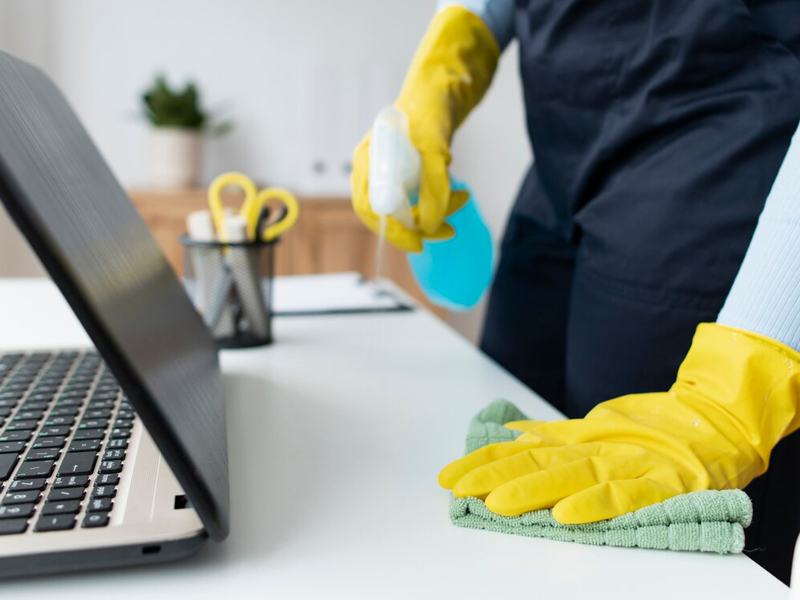 A cleaner cleaning a office cabin