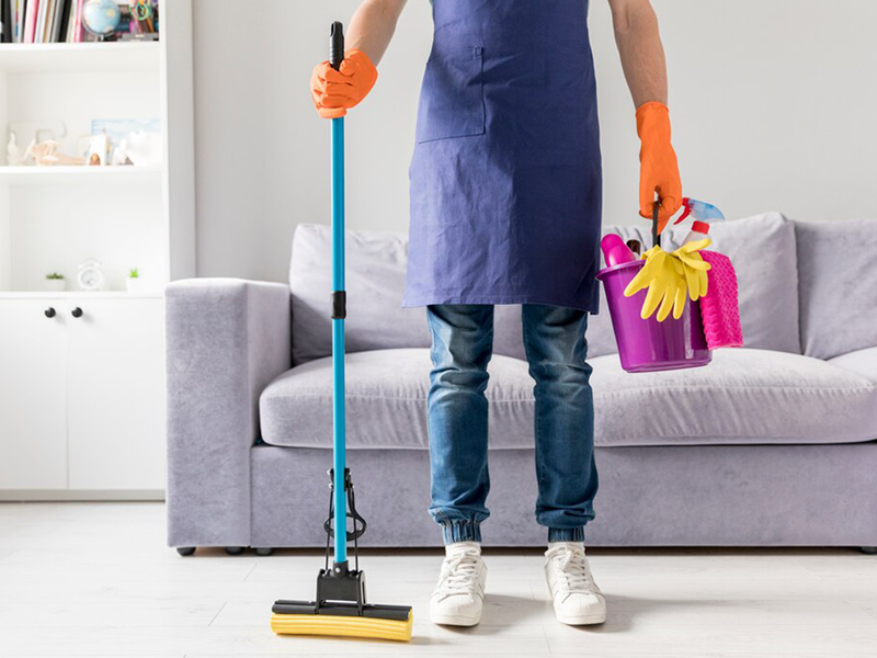 man cleaning table